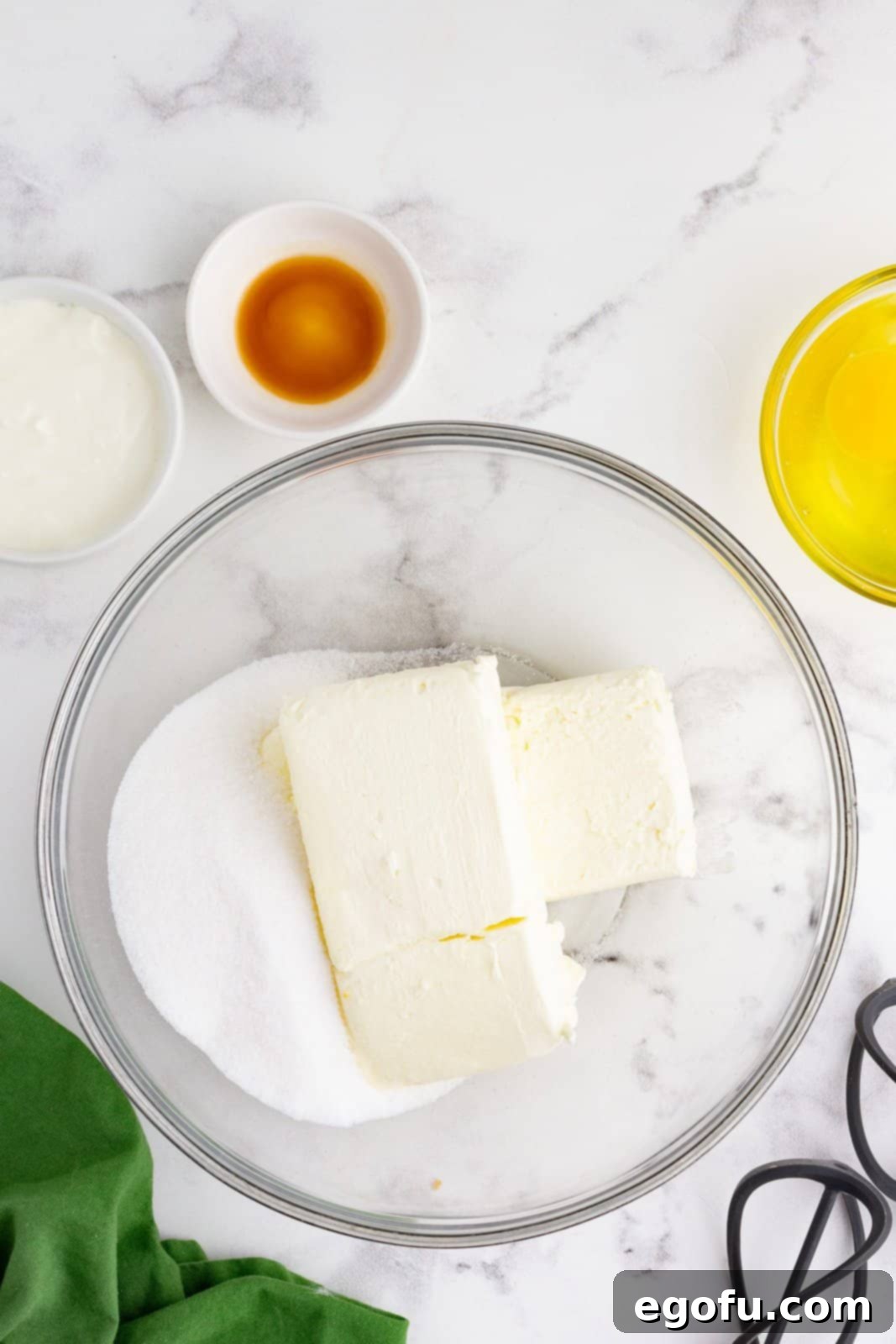 Jolly Santa Hat Cheesecakes 7 Cream cheese and sugar in bowl.