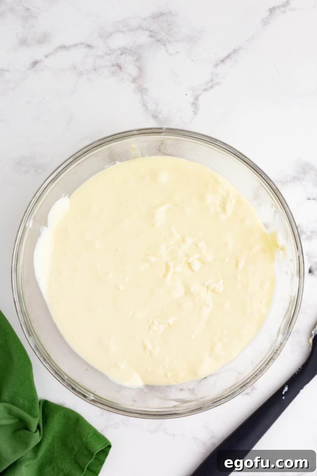 Jolly Santa Hat Cheesecakes 9 Cheesecake mixture blended together in bowl.