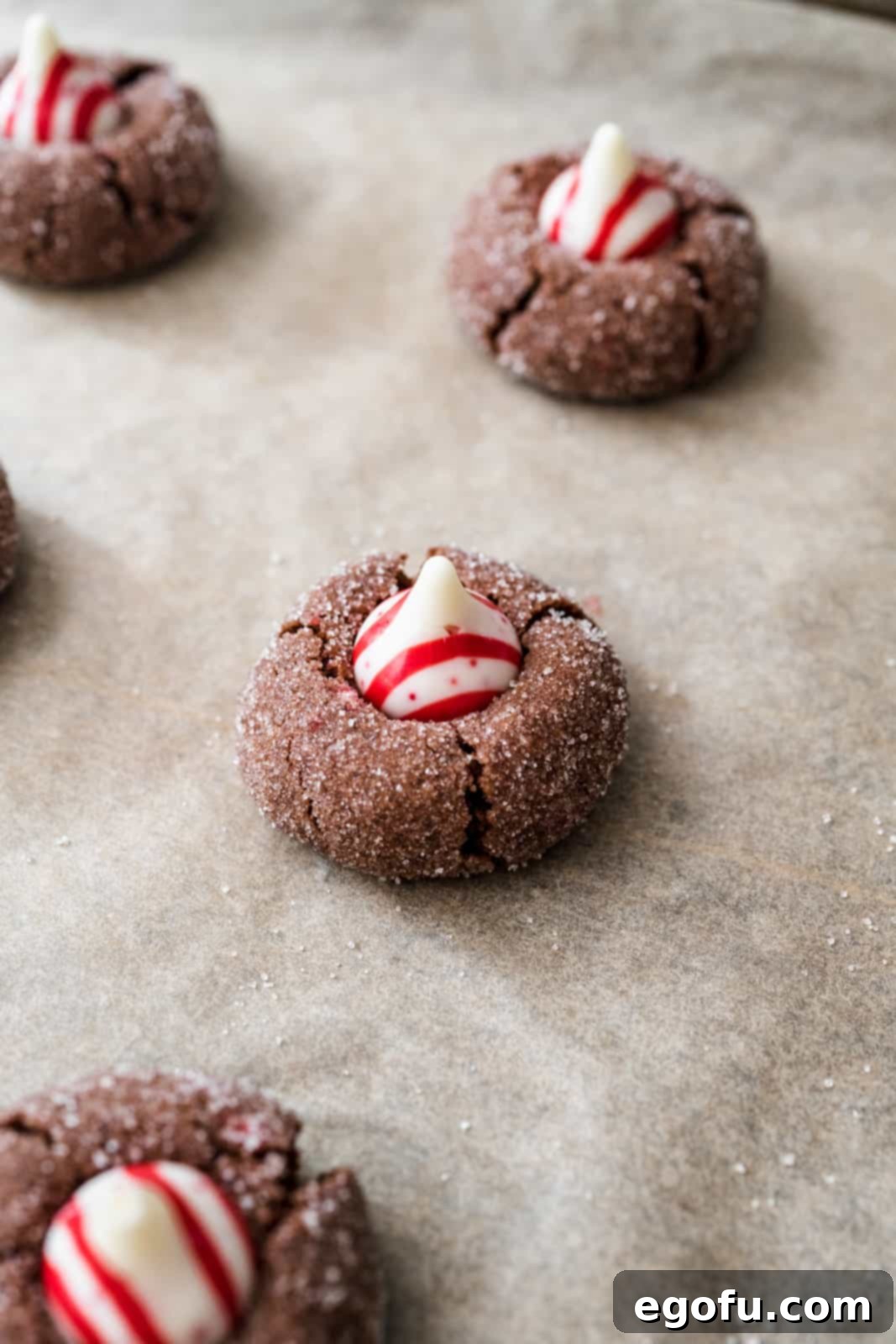 Candy cane kiss pressed into the top of baked cookies.