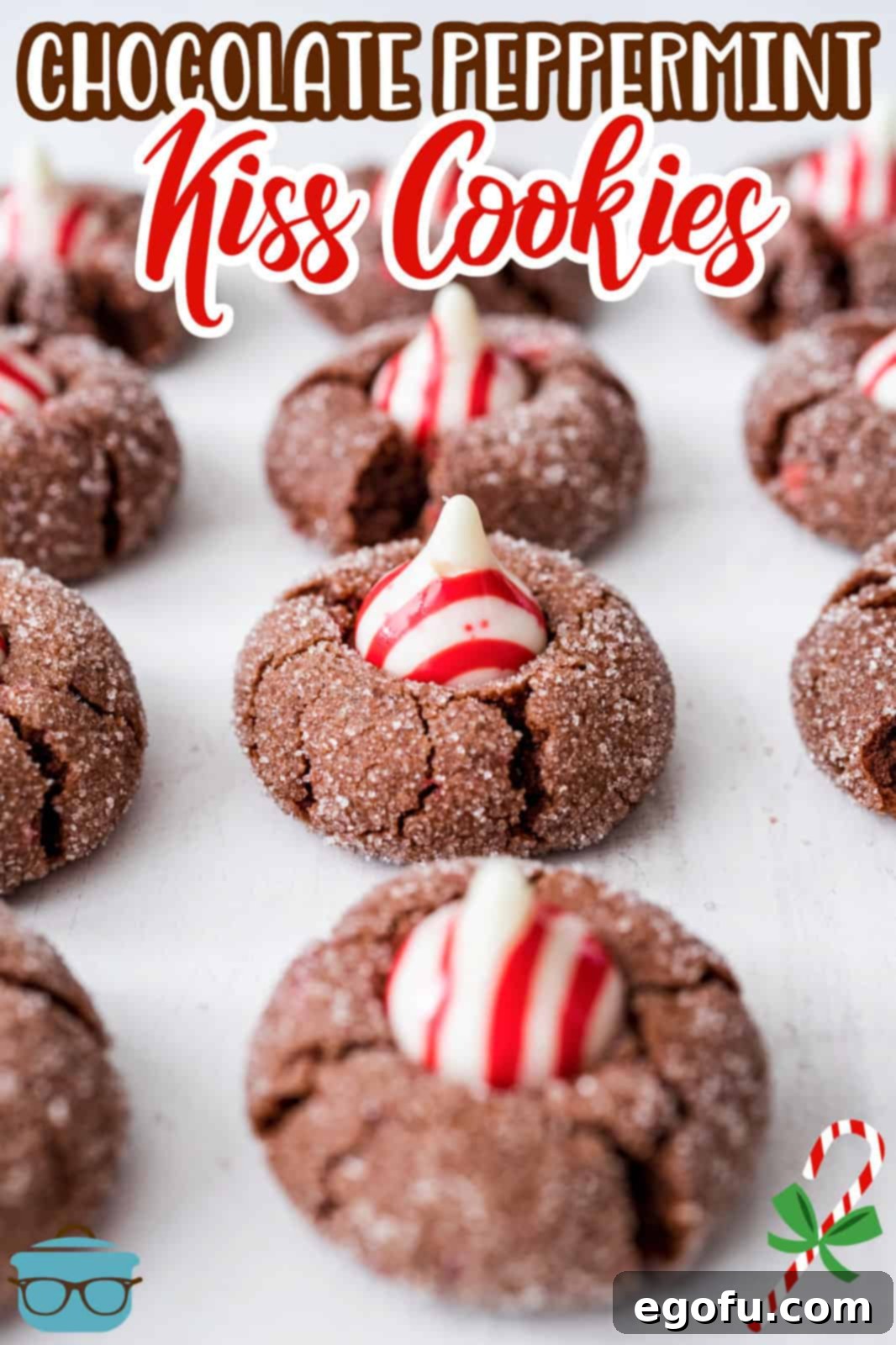 Lined up Chocolate Peppermint Kiss Cookies on white board, Pinterest image.