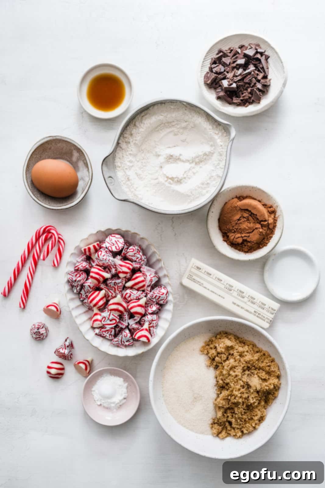 Ingredients needed: semi-sweet chocolate, unsalted butter, granulated sugar, light brown sugar, egg, vanilla extract, peppermint extract, all-purpose flour, unsweetened cocoa powder, baking powder, salt, crushed candy canes (optional) and Hershey’s candy cane kisses.