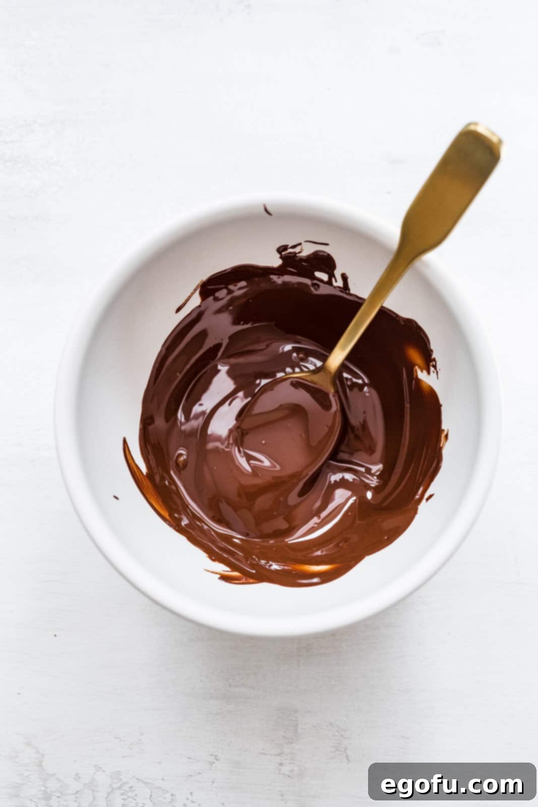 Melted chocolate in bowl.