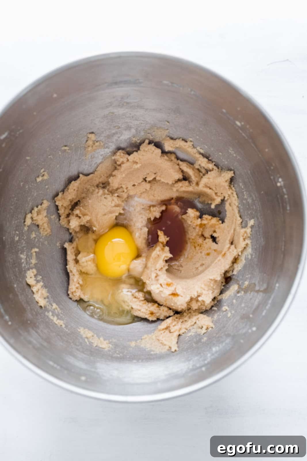 Egg, vanilla ane peppermint extracts added to the butter and sugar mixture in bowl of stand mixer.
