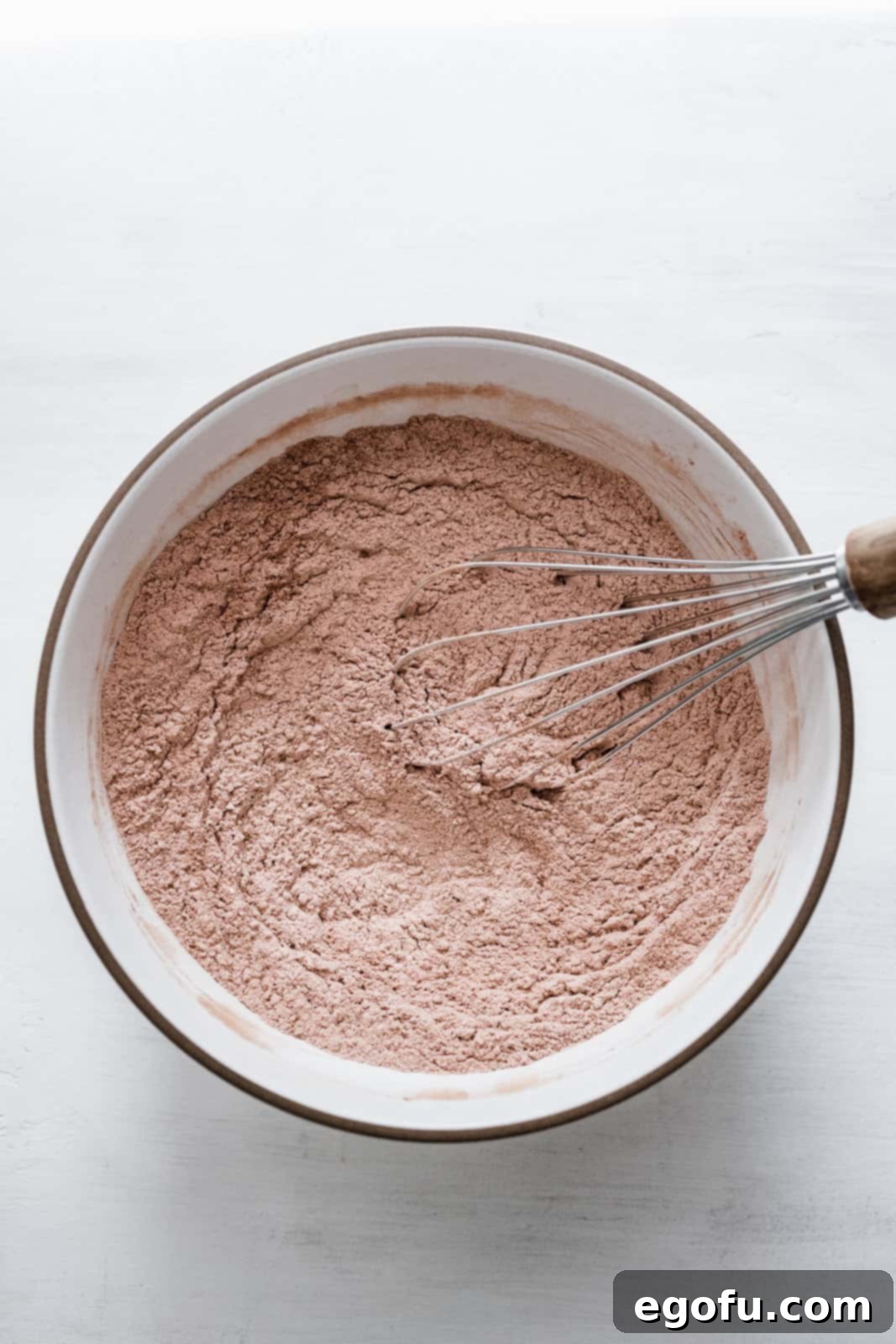 Flour, cocoa powder, baking powder and salt whisked together in bowl.