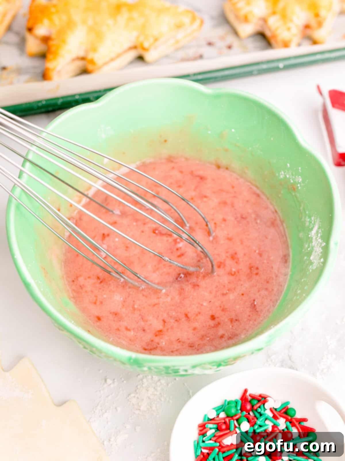 Sparkling Spruce Pop Tarts 9 Icing mixture for pop tarts being whisked in a bowl until smooth.