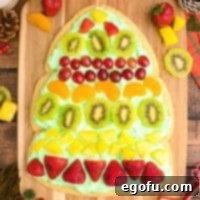 Overhead square image of finished and decorated Christmas Tree Fruit Pizza.