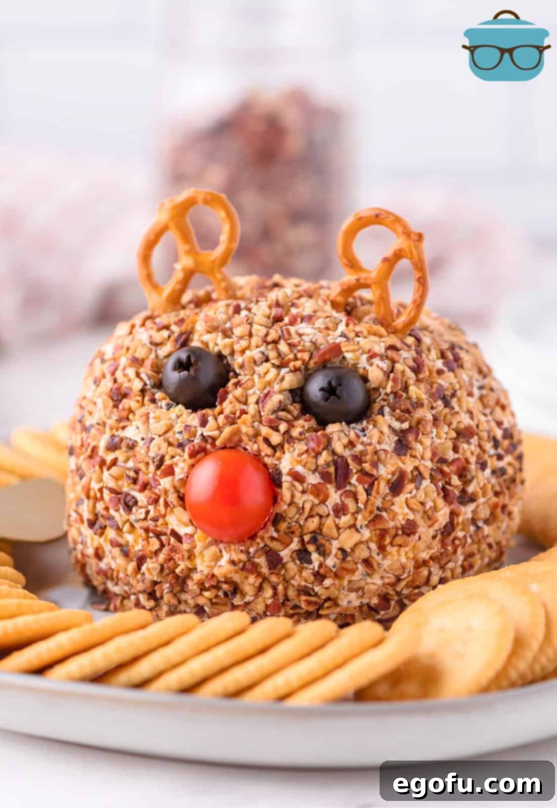 Rudolph Cheeseball on platter with crackers, ready to serve.