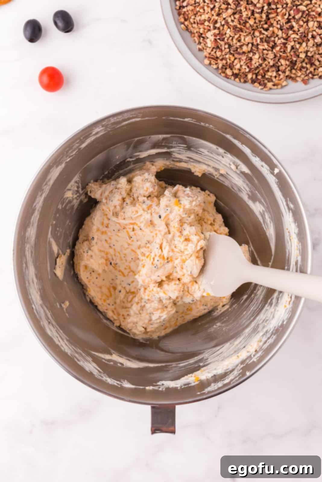 Cream cheese, cheddar cheese, and everything bagel seasoning mixed together in a stand mixer bowl until smooth.