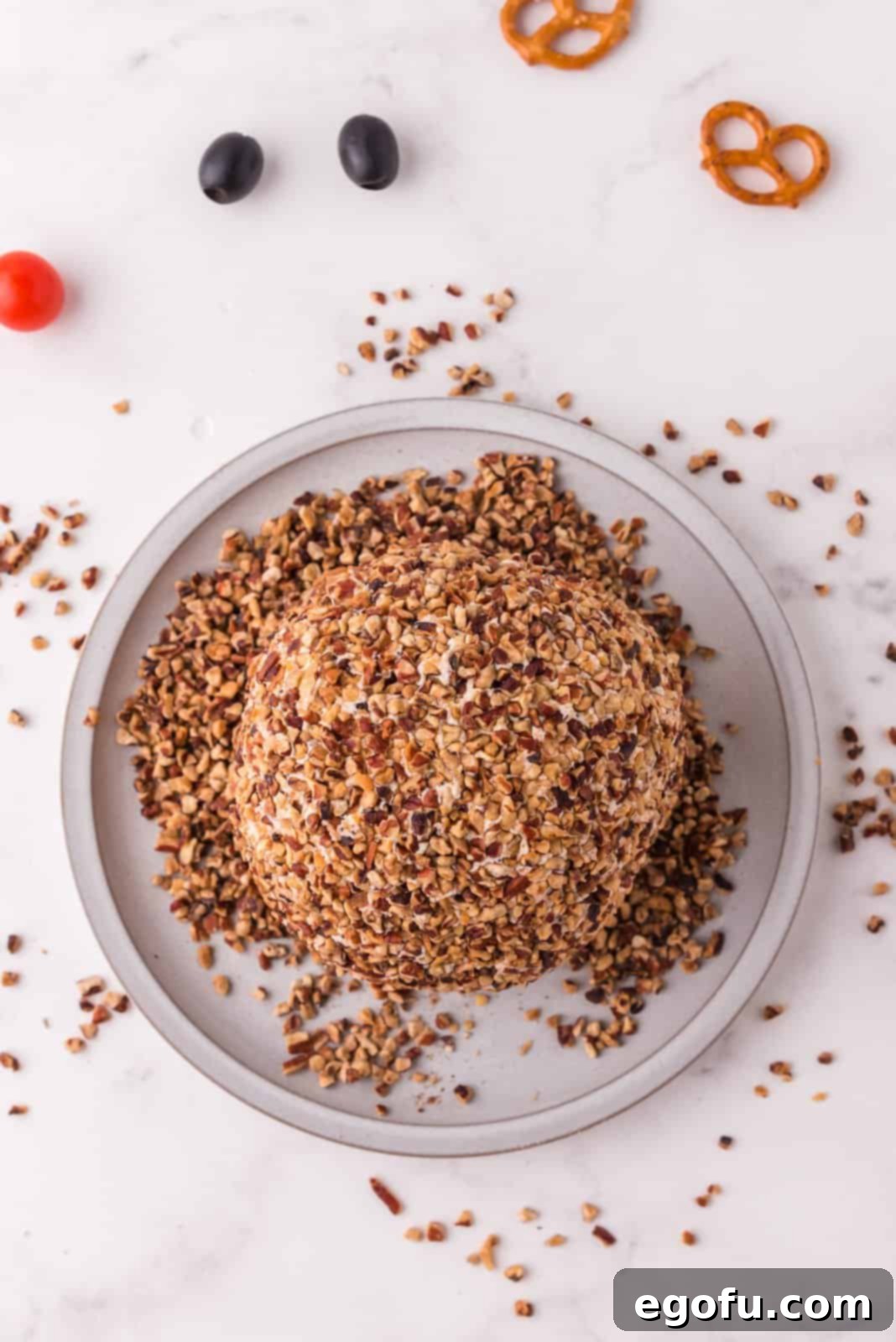Cheeseball rolled in finely chopped pecans for its coating.