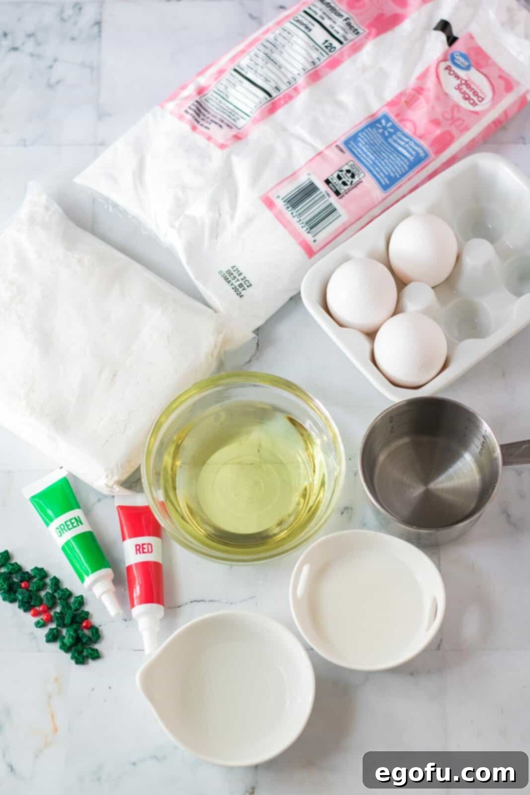 white cake mix, eggs, powdered sugar, oil, almond extract, read and green food coloring. 
