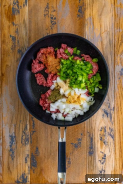 ground beef, onion, seasonings in a skillet.