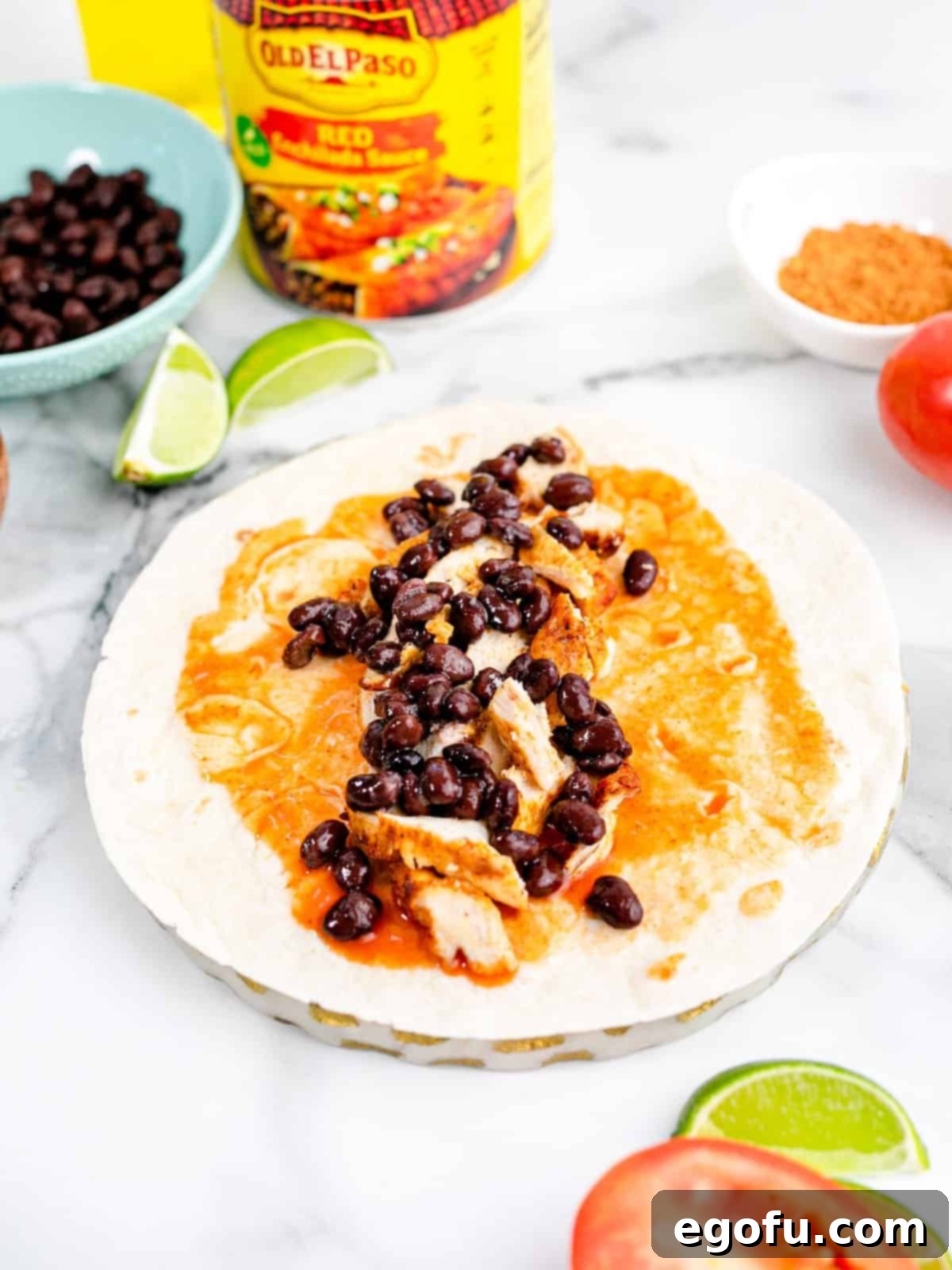 black beans layered on top of the chicken on the tortilla.