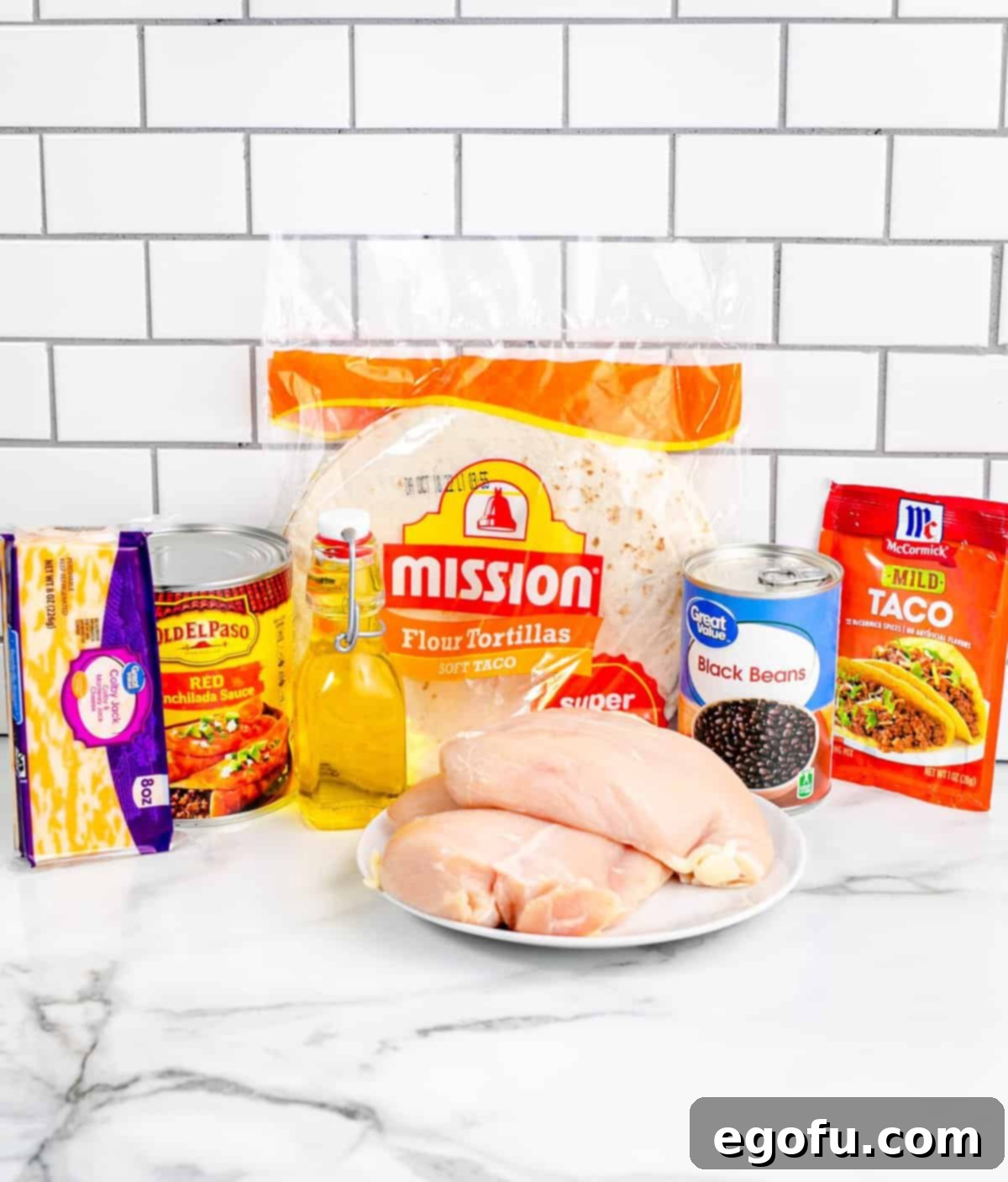 flour tortillas, chicken breast, taco seasoning, enchiladas sauce, black beans and Colby Jack cheese.