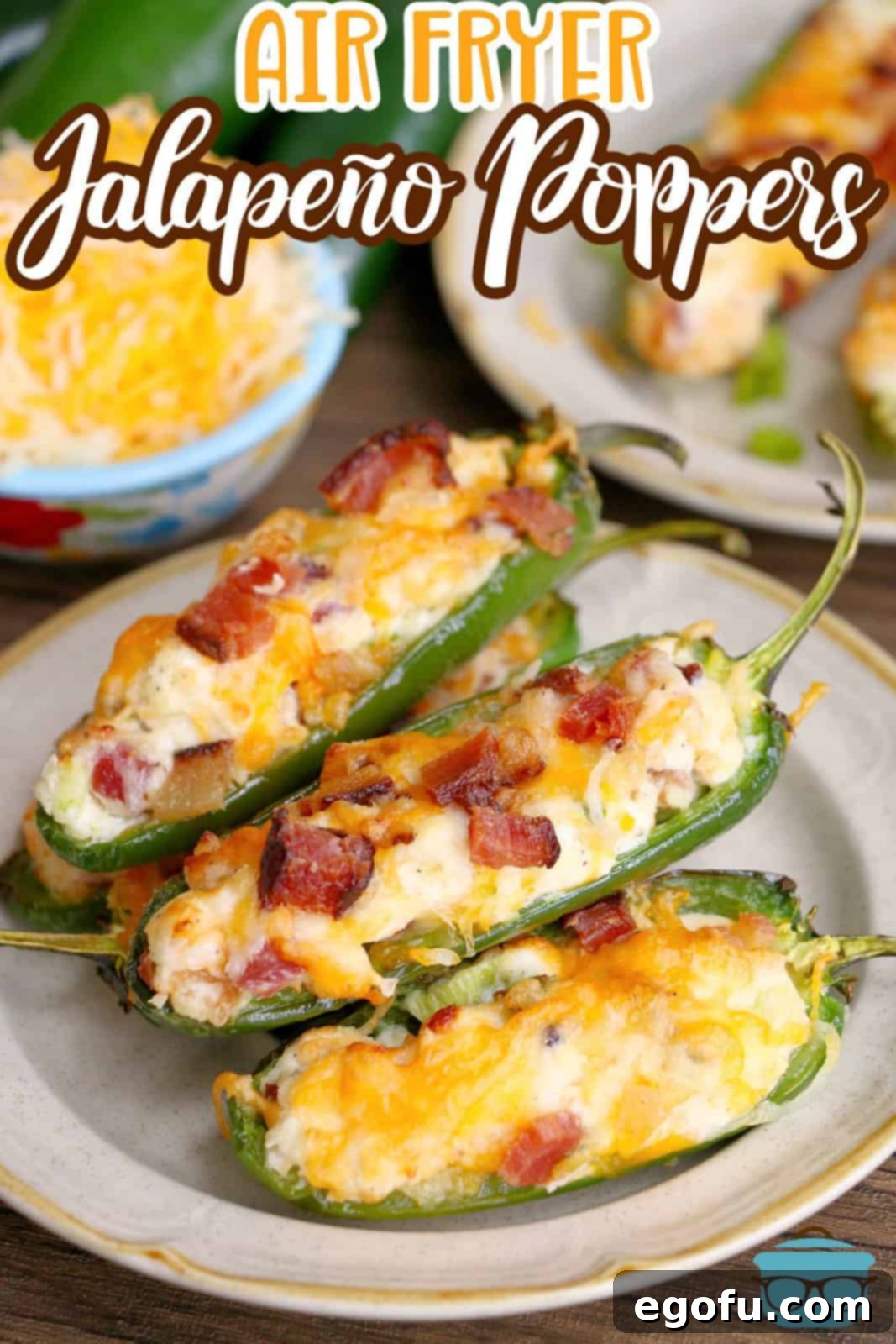 three jalapeño poppers shown on a round white plate.