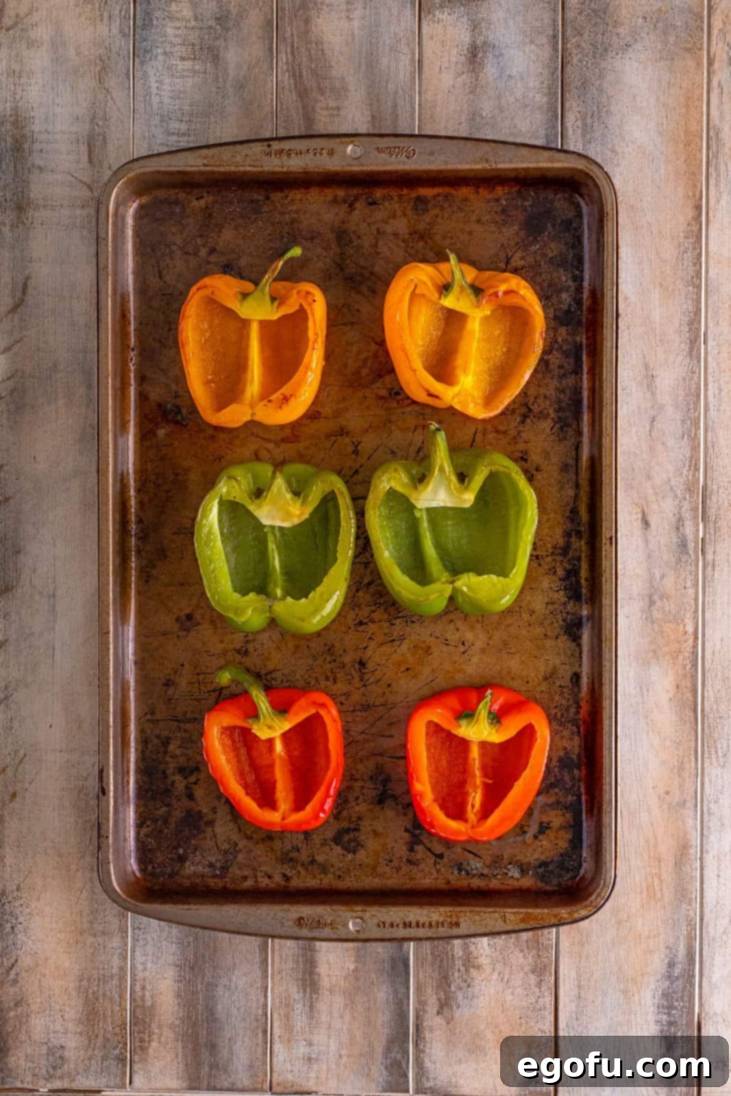 Philly Cheesesteak Pepper Boats 10 baked sliced bell peppers on a baking sheet.