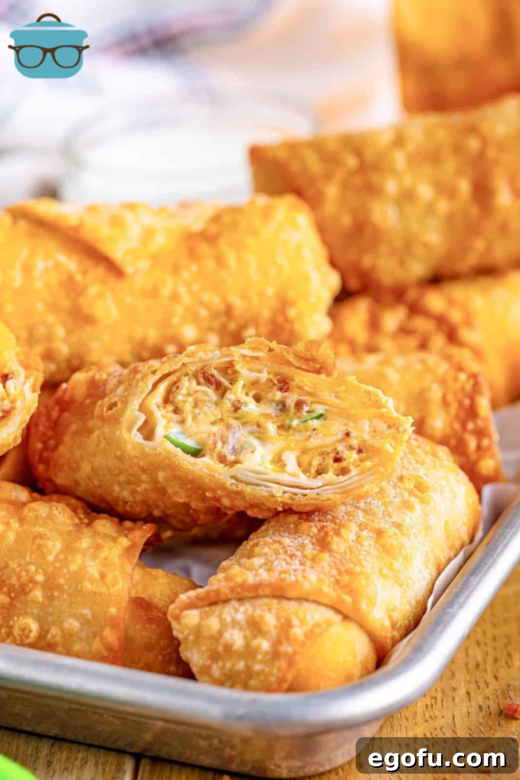 Spicy Creamy Egg Roll Poppers 2 A perfectly fried Jalapeno Popper Egg Roll, sliced open to reveal its creamy, spicy filling.