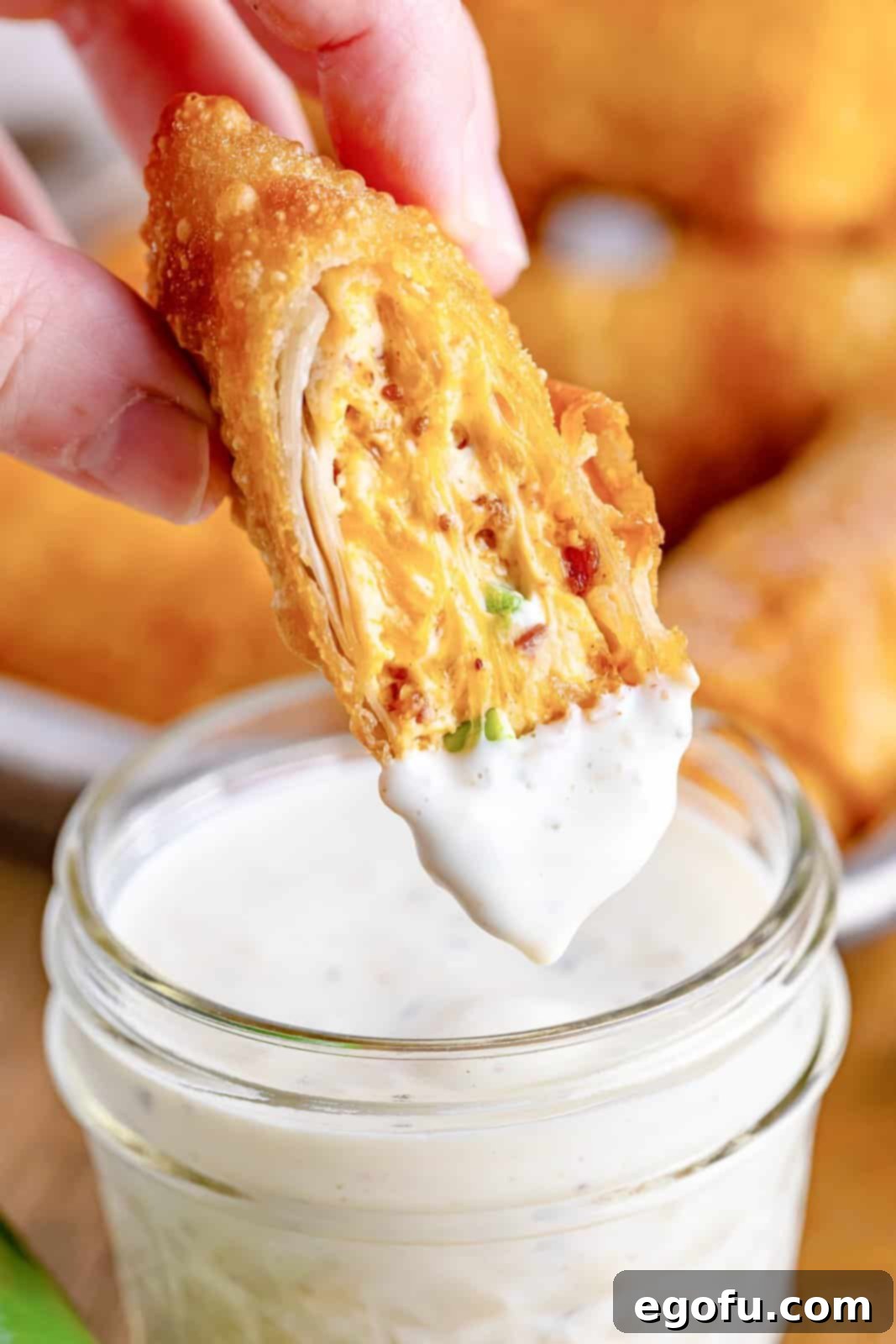 Spicy Creamy Egg Roll Poppers 13 A crispy jalapeño popper egg roll dipped in creamy ranch sauce.