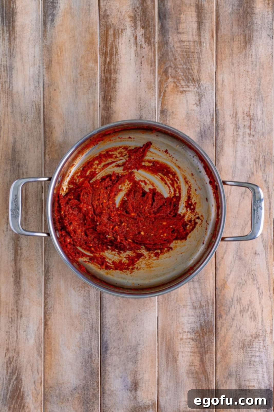 A skillet garlic, tomato paste, oregano, basil, onion powder, garlic powder, salt, and pepper.