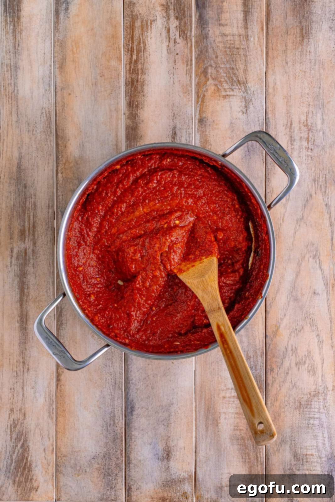A skillet full of tomato sauce.