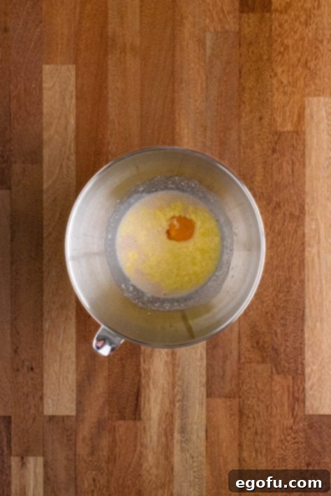 Butter Bathed Cloud Rolls 21 Bowl with butter, sugar, warmed milk, yeast, and egg.