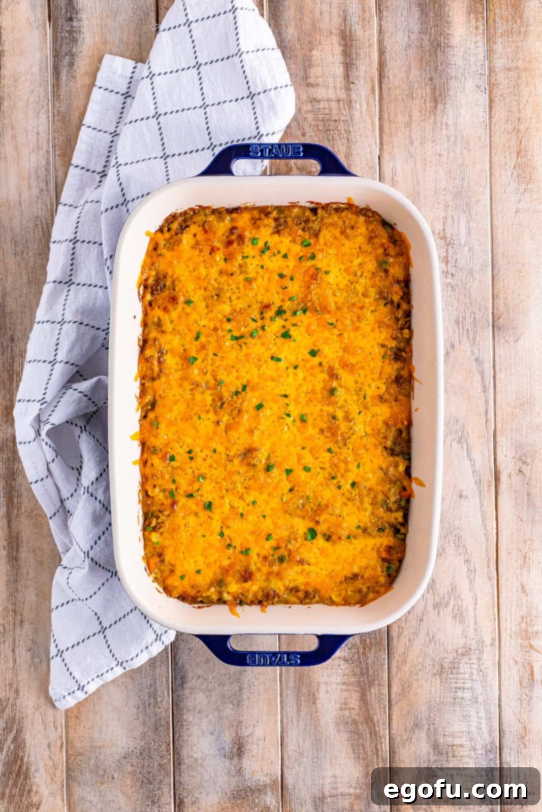 Golden Cheesy Beef and Rice Bake 9 A casserole dish with beautifully melted and lightly browned cheese on top, having just come out of the oven or broiler.