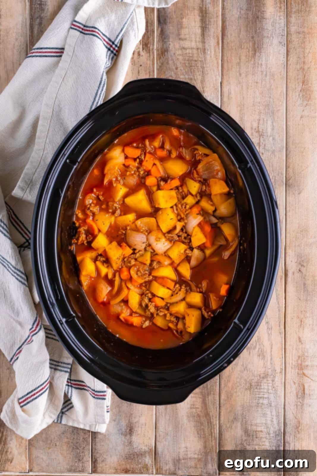 Slow Cooker Humble Stew 7 A slow cooker full of delicious cowboy stew, steaming hot and ready to eat.