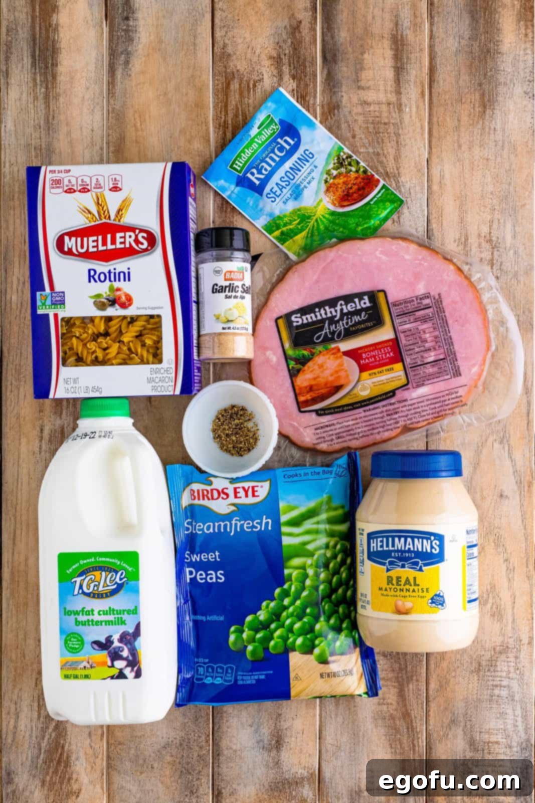 Ruby Tuesday Inspired Creamy Pasta Salad 3 Rotini noodles, mayonnaise, buttermilk, ranch seasoning, garlic salt, black pepper, frozen peas, and ham.