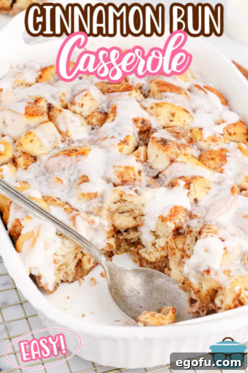 Pull-Apart Cinnamon Delight 3 A baking dish filled with a delicious Cinnamon Bun Casserole, with one serving already taken, showing its inviting texture.