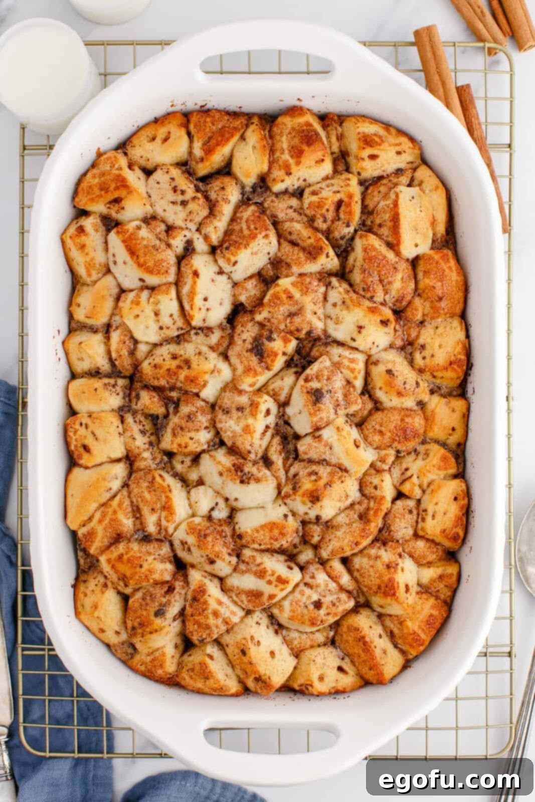 Pull-Apart Cinnamon Delight 8 A perfectly baked casserole dish filled with golden brown Cinnamon Bun Casserole, fresh from the oven.