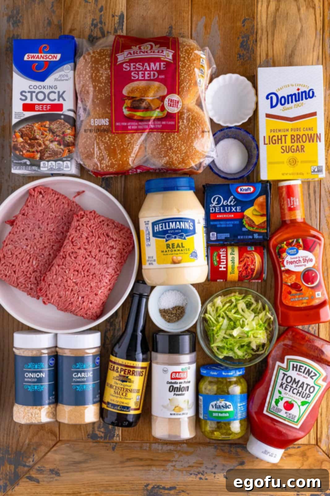 Mac Attack Sloppy Joes 4 Ground beef, mayo, French dressing, dill pickle relish, dried minced onion, garlic powder, white vinegar, granulated sugar, beef stock, ketchup, tomato paste, light brown sugar, Worcestershire sauce, onion powder, kosher salt, black pepper, sesame seed buns, shredded lettuce, and American cheese.