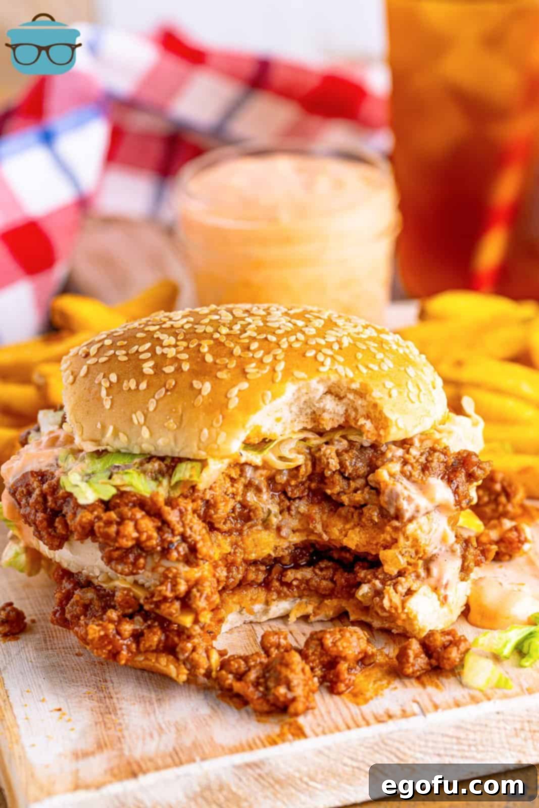 Mac Attack Sloppy Joes 9 A Big Mac Sloppy Joe sandwich with a bite taken out and fries behind it.