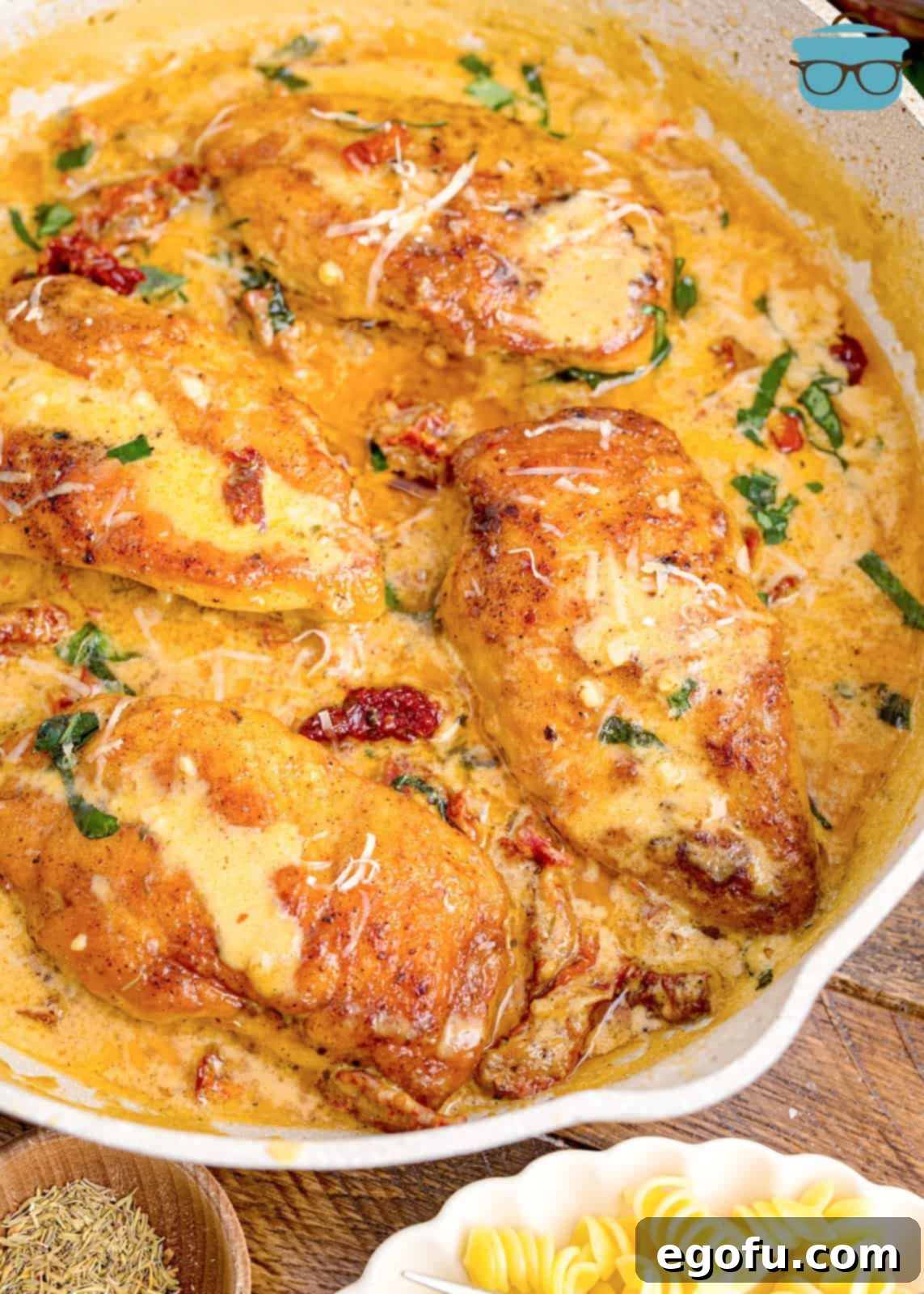 Proposal Chicken 2 A serving dish of Marry Me Chicken, showcasing tender chicken pieces in a rich, creamy sauce with sun-dried tomatoes.