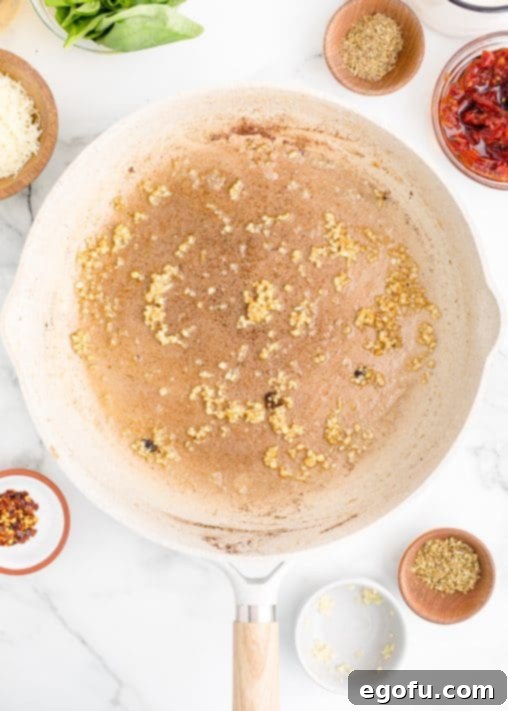 Proposal Chicken 12 Minced garlic in a pan.