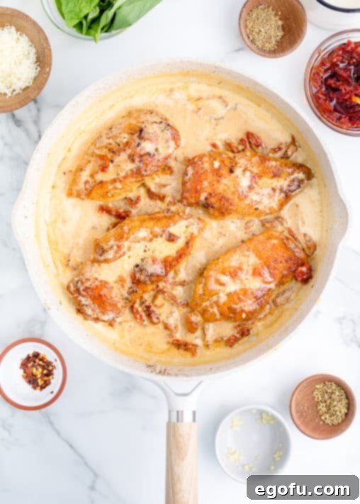 Proposal Chicken 15 A pan with cooked chicken in the creamy, rich sauce.