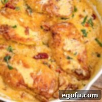 Proposal Chicken 9 A close up of Marry Me Chicken in a dish with, rich and creamy cheesey sauce.