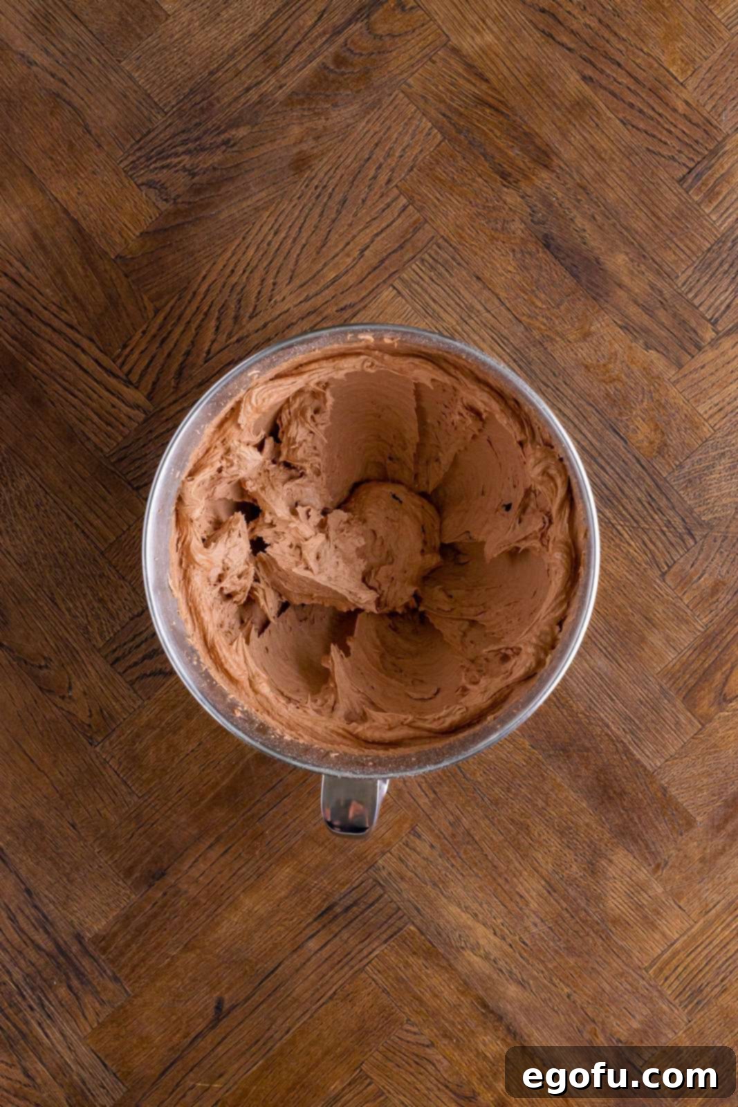 Butter, cocoa powder, powdered sugar, milk, and vanilla all mixed together. 