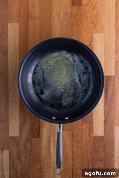 Skillet with melted butter.