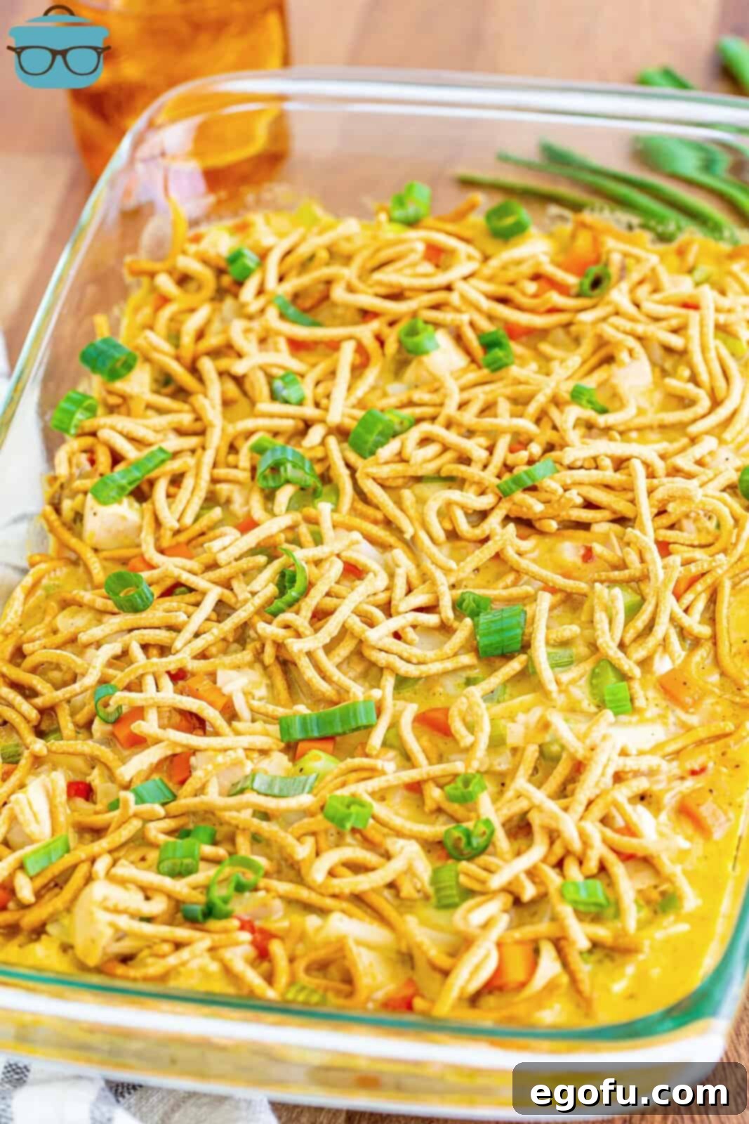 A baking dish with chicken chow mein casserole.