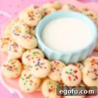 A pink plate of mini sweetened condensed milk cookies.