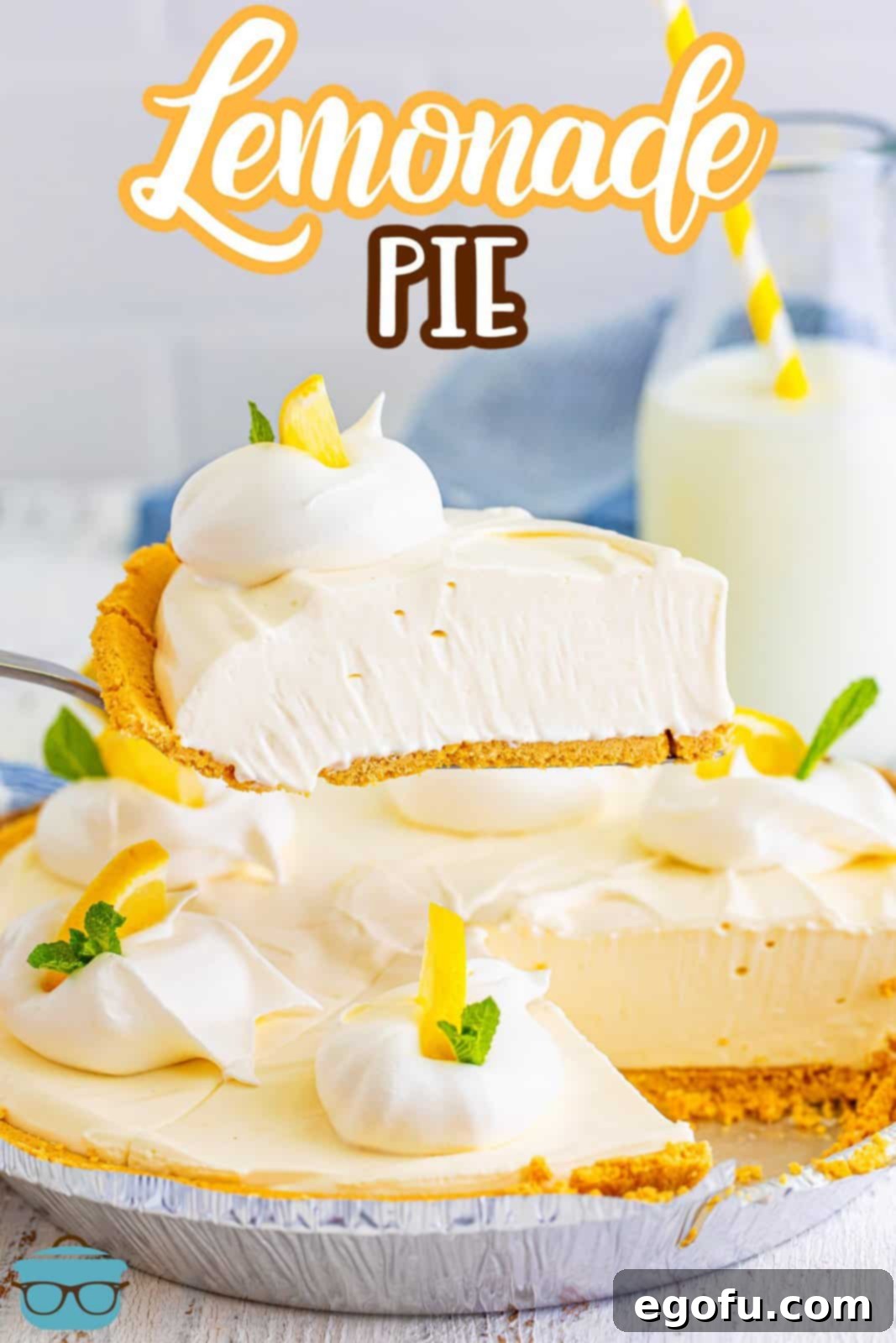 A serving utensil lifts a perfectly portioned slice of cold Lemonade Pie, showcasing its creamy texture.