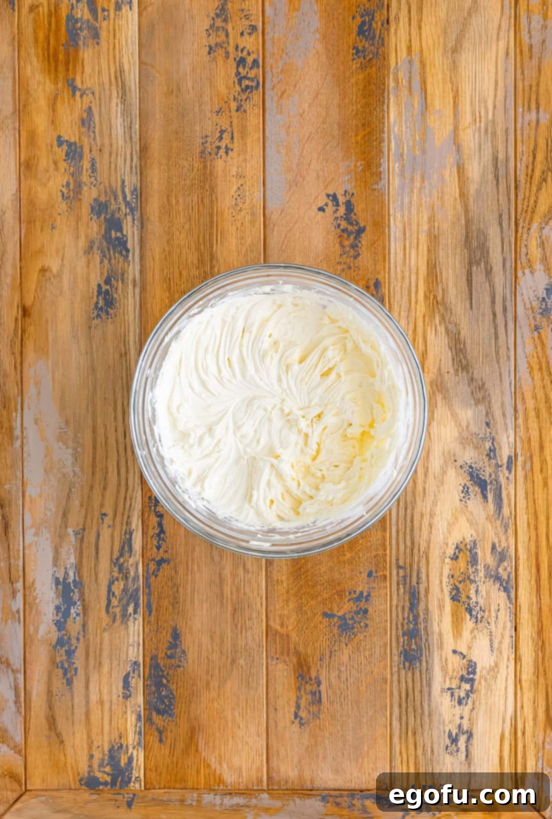 Bowl of vanilla, butter, milk, and sugar mixed together.