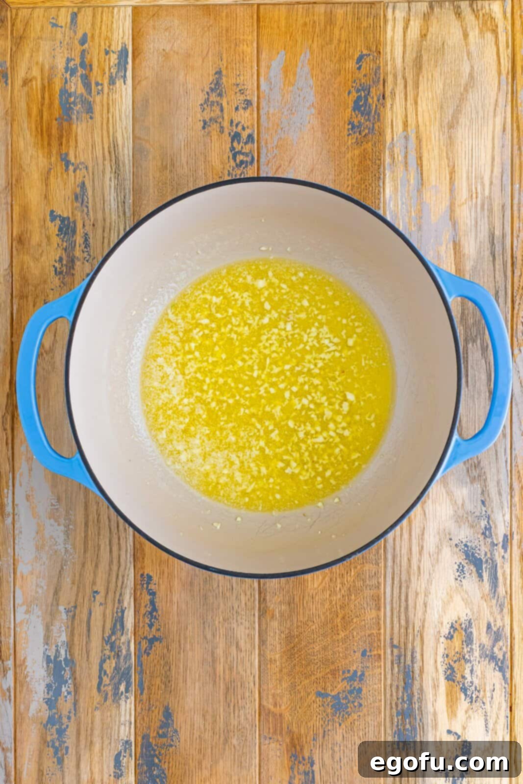 A pot of melted butter and garlic. 