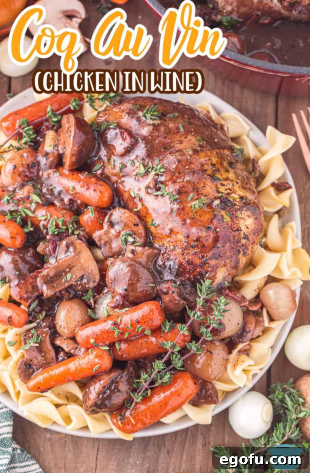 A beautifully plated serving of Coq Au Vin with fresh herbs, alongside individual ingredients like mushrooms and red wine.