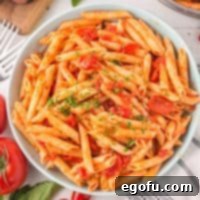 Penne with Garden Tomato Sauce 14 Looking down on a bowl of penne with tomato sauce.