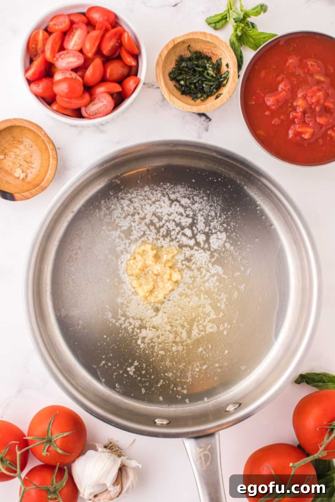 Penne with Garden Tomato Sauce 5 Melted butter and garlic cooking in a pan.