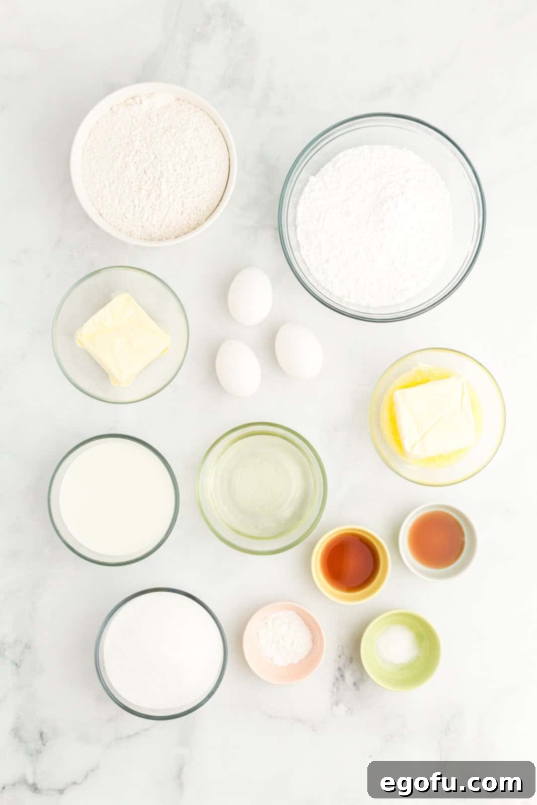 flour, baking powder, salt, unsalted butter, sugar, oil, eggs, vanilla extract, milk and powdered sugar. 