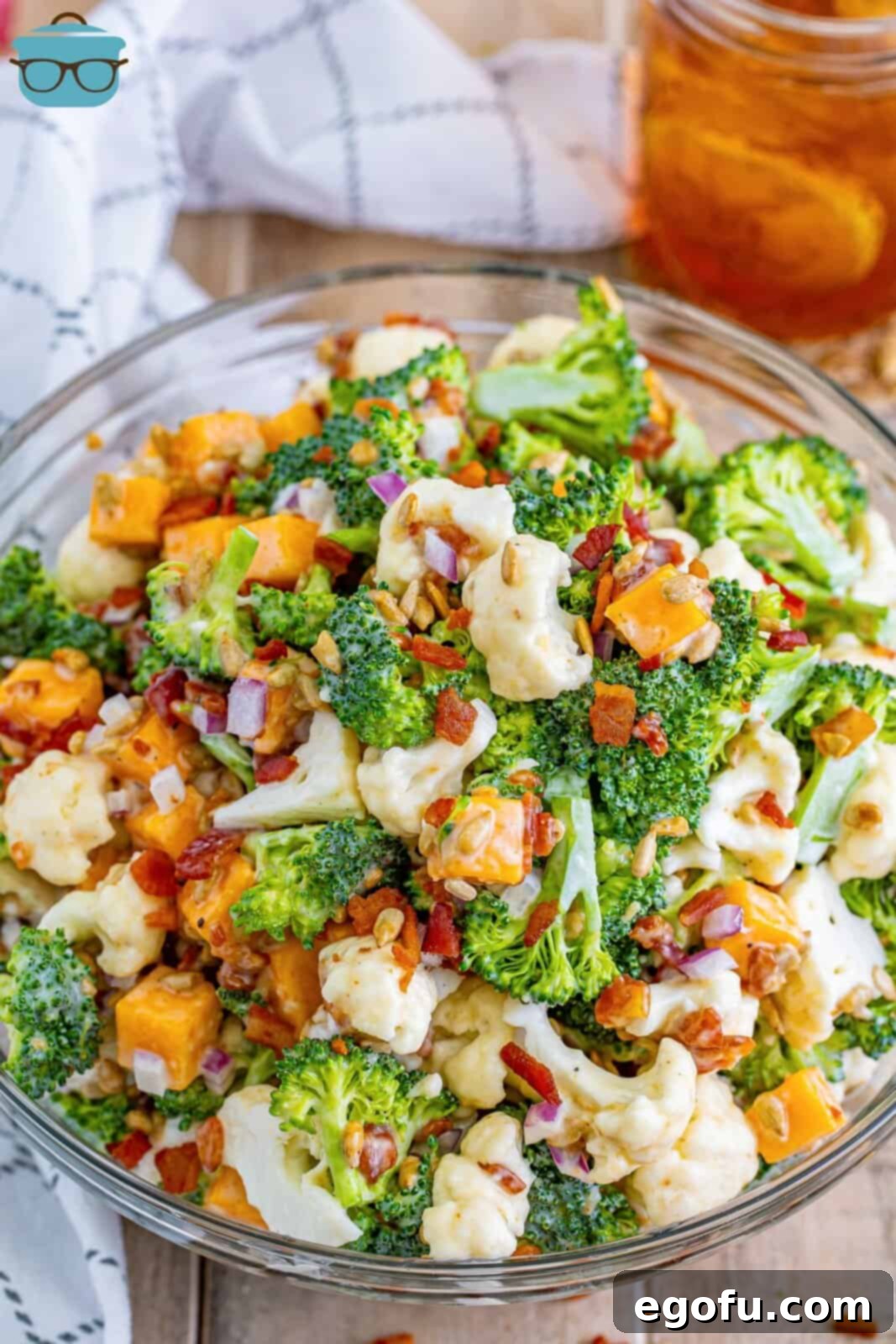 A vibrant bowl of fresh broccoli and cauliflower salad, beautifully garnished and ready to serve.