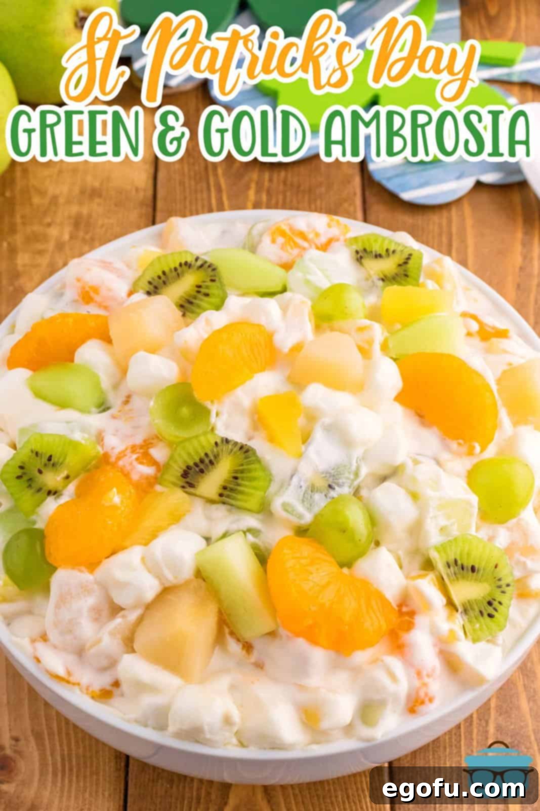Emerald and Golden Ambrosia Delight 3 A beautifully presented bowl of Green and Gold Ambrosia Salad, showcasing the diverse fruits and creamy dressing.