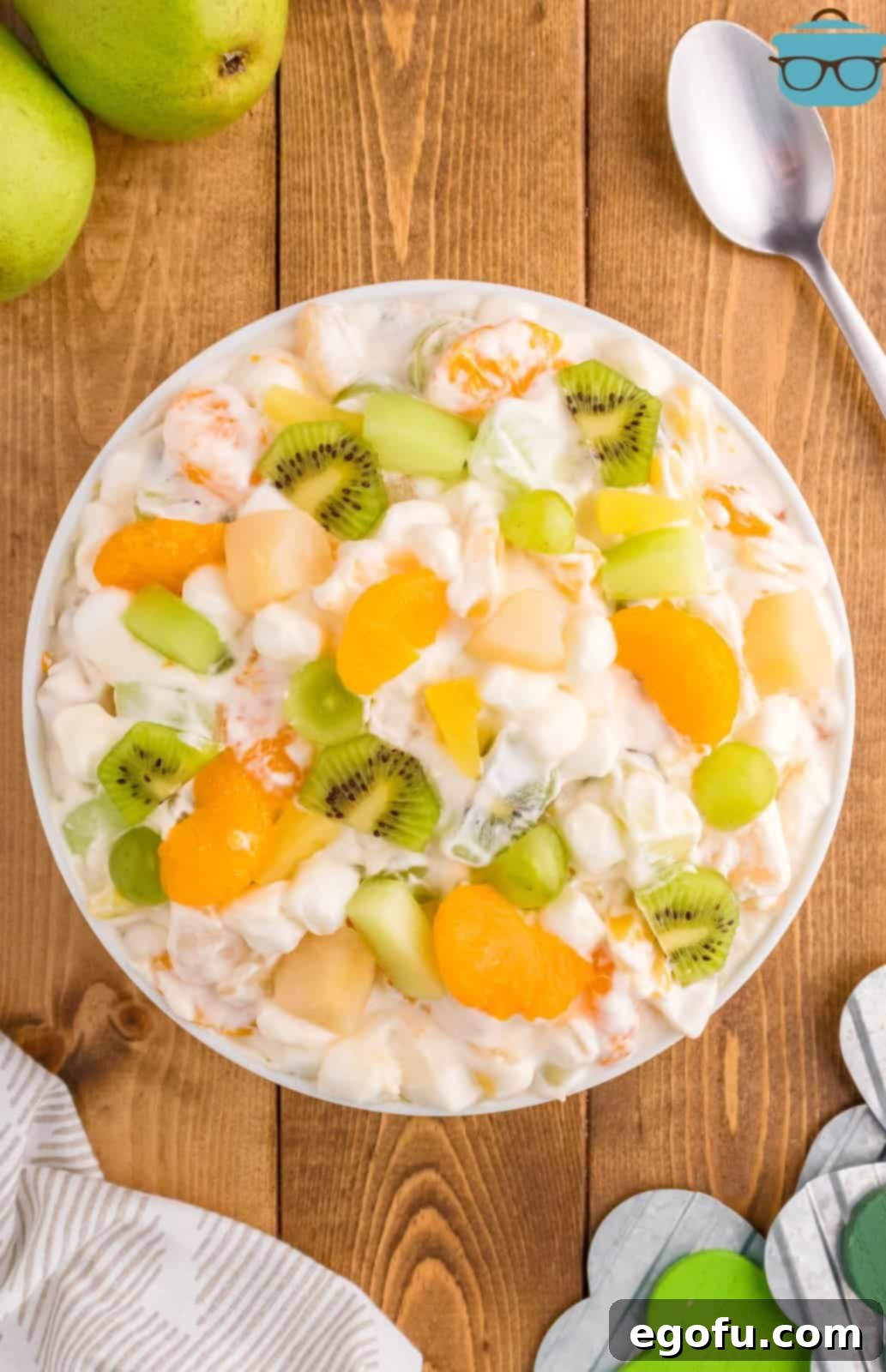 Emerald and Golden Ambrosia Delight 9 A top-down view of the chilled Green and Gold Ambrosia Salad, showcasing its readiness to be served.