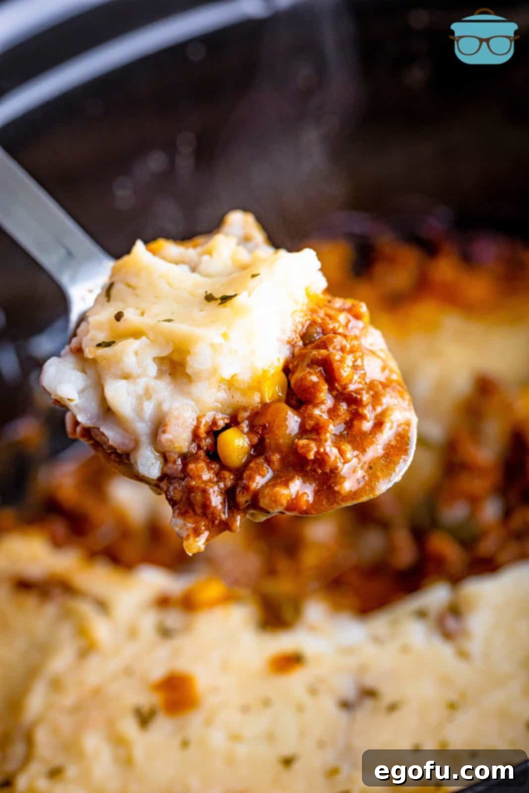 Comforting Slow Cooker Shepherd's Pie 2 A serving utensil with a bite of Shepherd's Pie.
